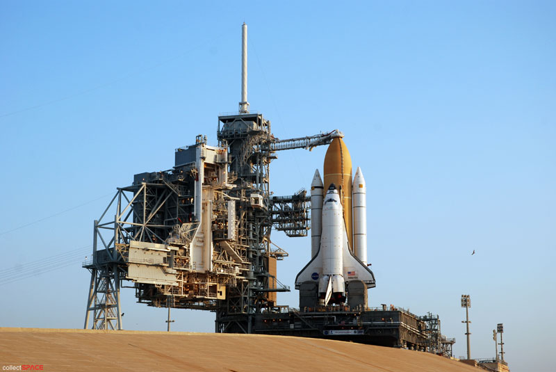 Atlantis and astronauts at the pad