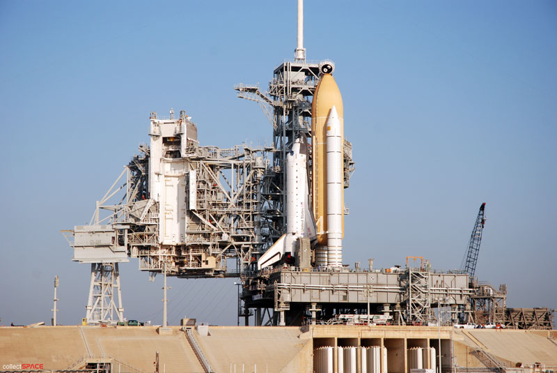 Atlantis and astronauts at the pad