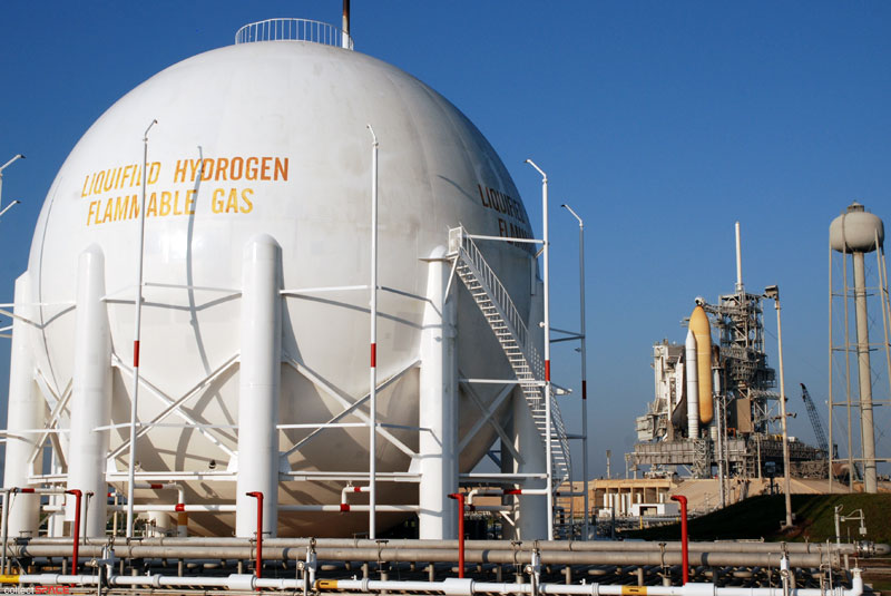 Atlantis and astronauts at the pad