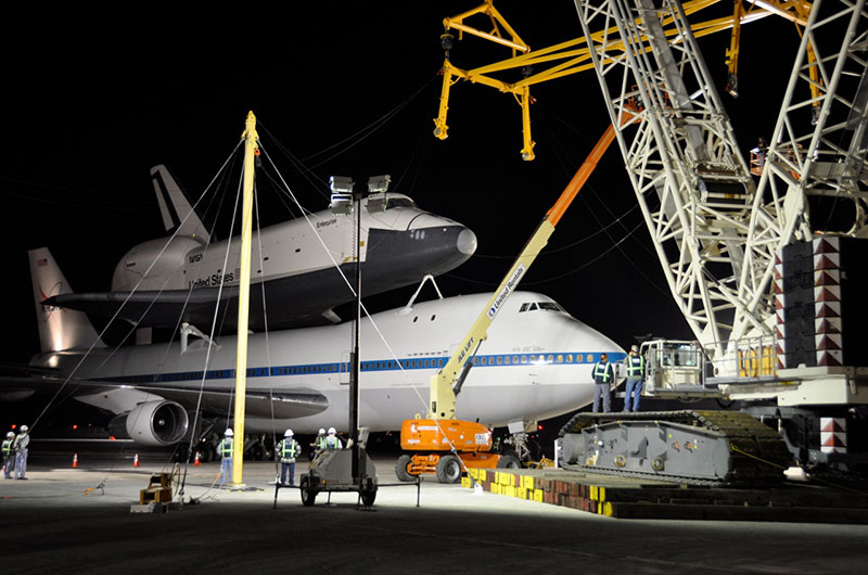 Space shuttle Enterprise hoisted off jumbo jet in New York