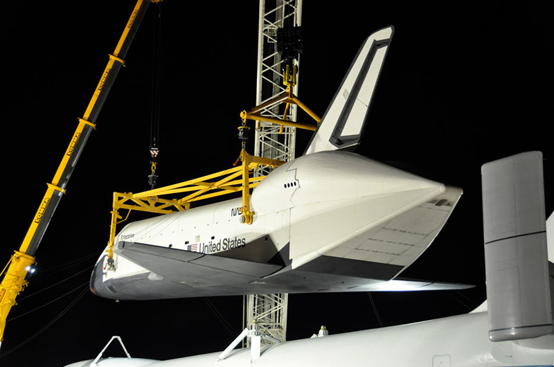 Space shuttle Enterprise hoisted off jumbo jet in New York